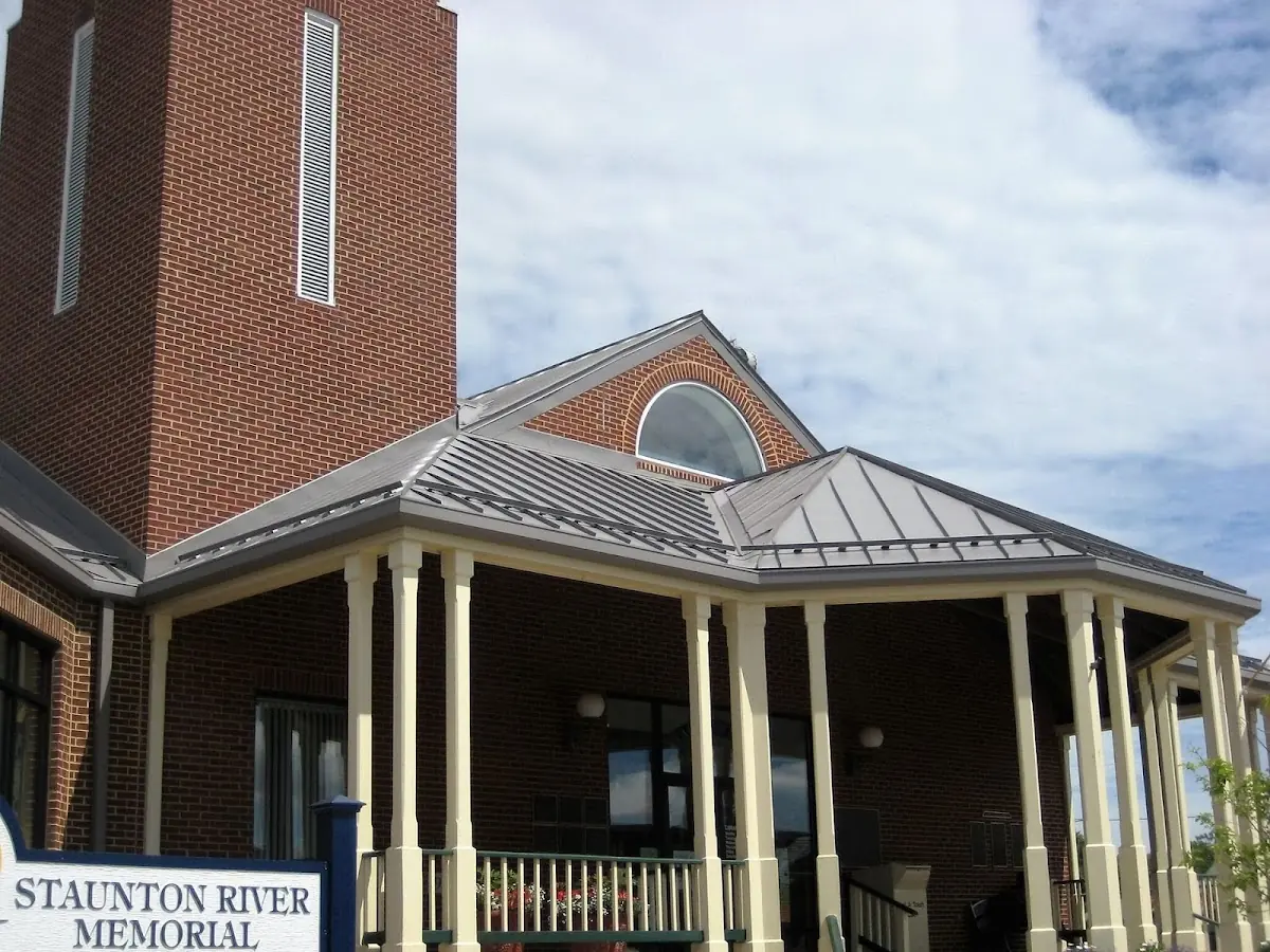 Skilled roofing craftsmen working on a residential roof in Adelphi